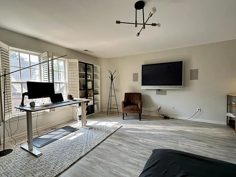 Speakers built into the wall; TV comes with house by default, compatible with AppleTV, Roku, FireTV