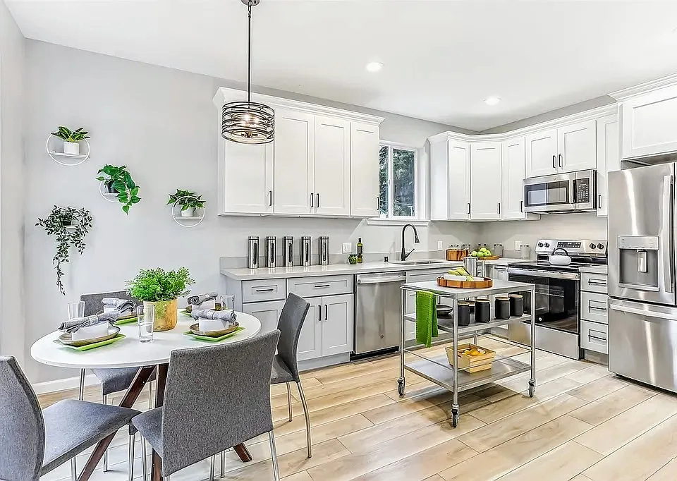 Dining Area and Kitchen with brand new appliances (shown with representative furniture - otherwise unfurnished)