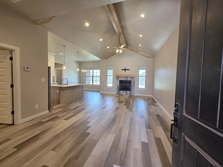 The laundry room is to the left of the front door off the kitchen area