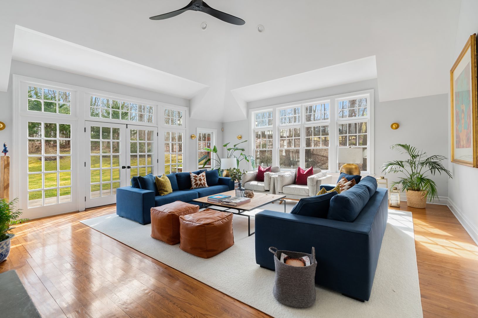 Light drenched Living Room with Cathedral Ceilings