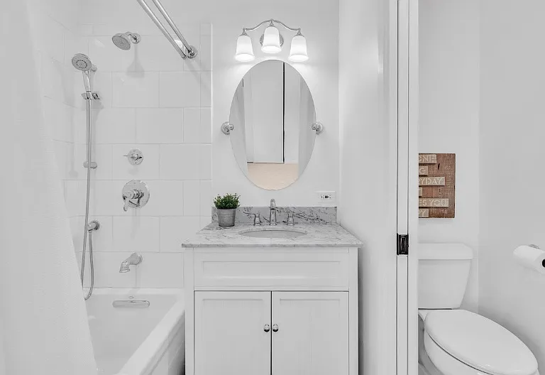 Master en-suite bath with tub, shower, vanity and shared "jack/jill" toilet