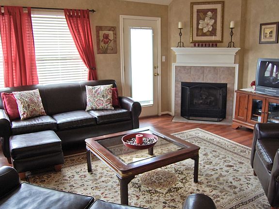 Family Room includes laminate floors & gas log in fireplace