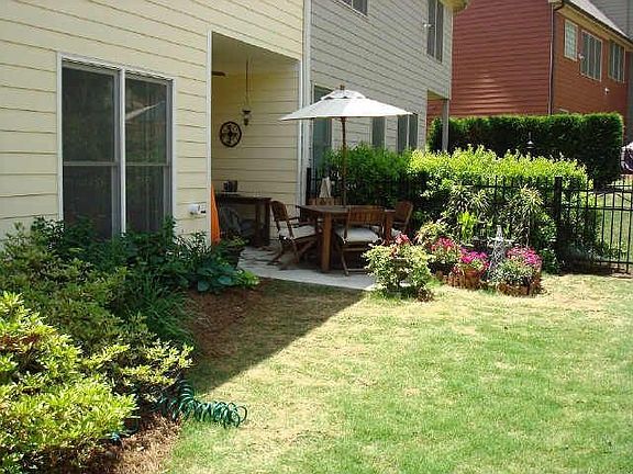 Patio with fenced back yard