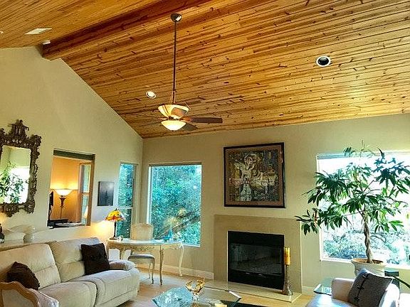 Recessed lighting and marble fireplace