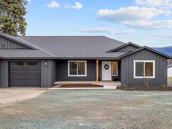 Composite roofing, wood detail, crisp white trim and classy dark exterior paint make this home the leader on must haves.