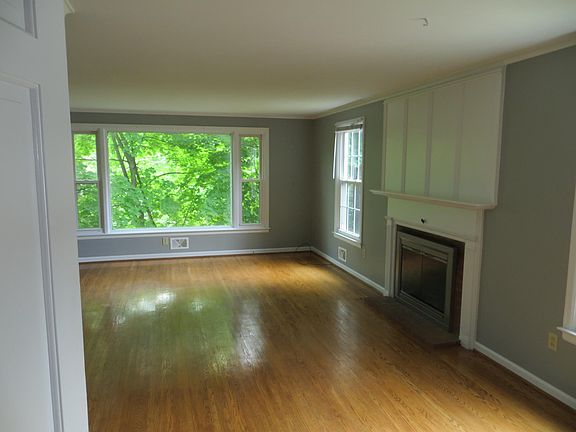 Living Room with woodturning fireplace.