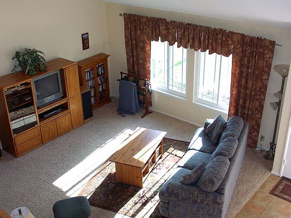 Living room with vaulted ceilings.