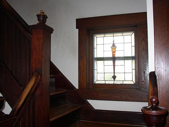 Oak molding and trim throughout and one of two beautifull stain glass windows.