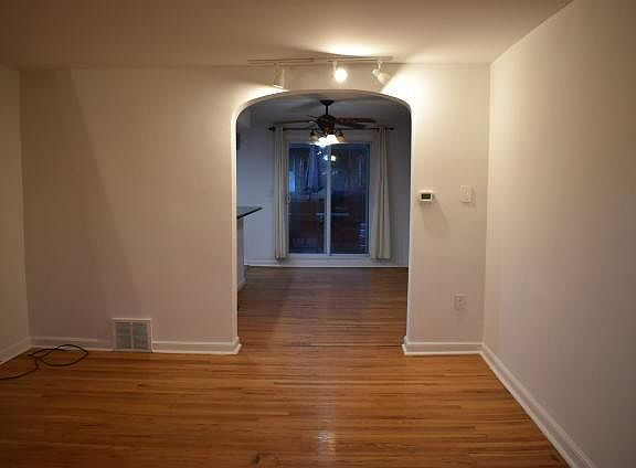 View of dining room and deck door from living room
