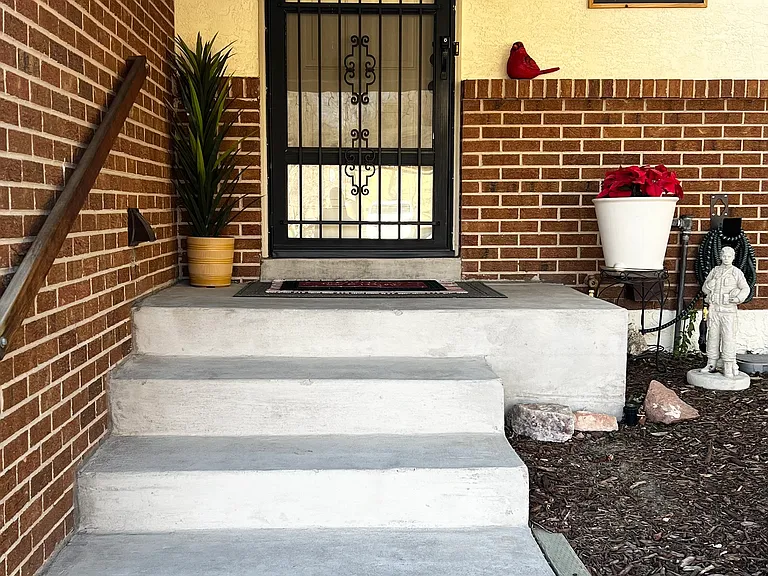 Well-lit shared front entrance.
