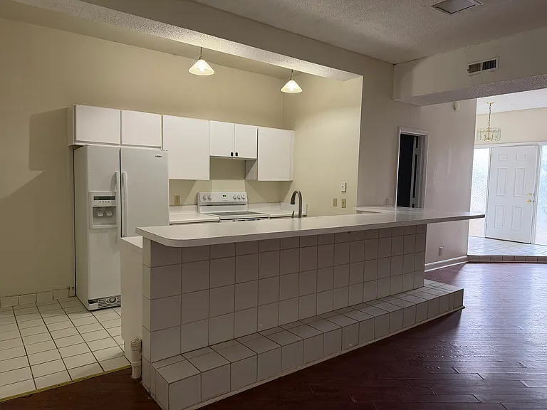 Kitchen (front door/main entry in the background). check out that natural light!