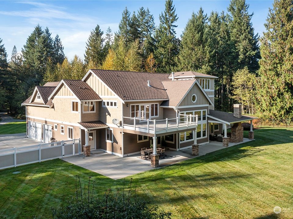 Nestled on 12+ acres, this quiet abode is surrounded by an inspiring lush greenbelt and beautiful landscape. Watch the deer and local wildlife wander thru the property.>