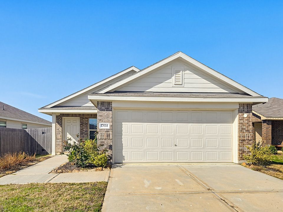 Welcome home! This stunning 2022-built residence features a classic brick exterior, a charming front porch, and great curb appeal in the quiet Pinewood at Grand Texas community.