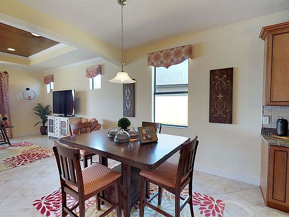 Sanibel 3 car garage floor plan casual dining area off the kitchen by William Ryan Homes Tampa
