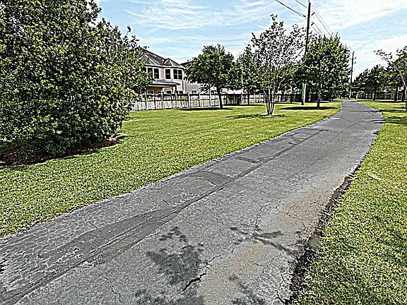 ENJOY A RELAXING AFTERNOON STROLL ON THE TRAIL NEXT TO THE HOME
