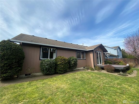 Backyard is private with mature Arborvitae trees along East property line.