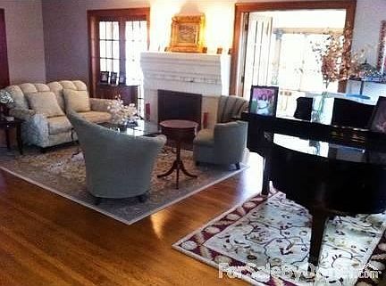 Formal Living Room
						:
						Double French doors between this room, the dining room, and the sun room