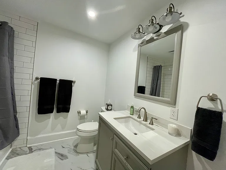Fully Renovated New Bathroom with Subway Tiled Tub & Shower, New Toilet. New Granite Sink Countertop. New LVT Flooring. Freshly Painted.