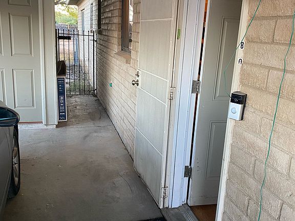 Entrance to house through carport