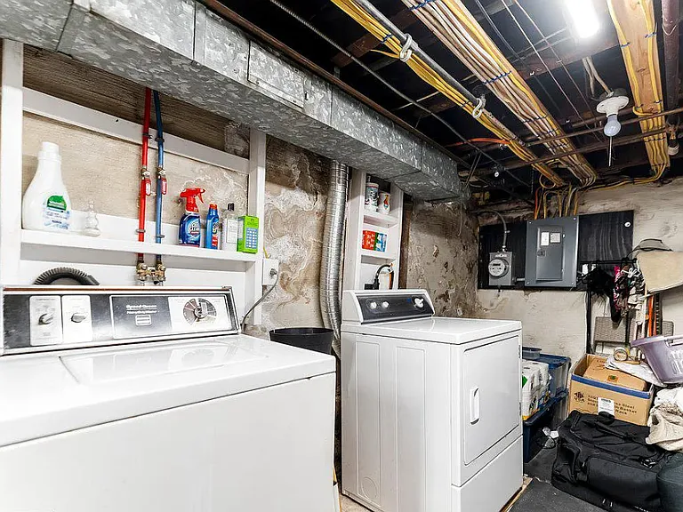 washer dryer in basement 
further built in storage space in basement