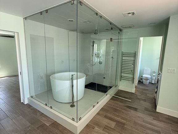 Master shower is also an enclosed steam shower with japanese soaking tub.