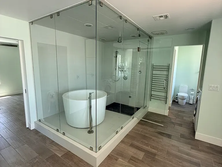 Master shower is also an enclosed steam shower with japanese soaking tub.