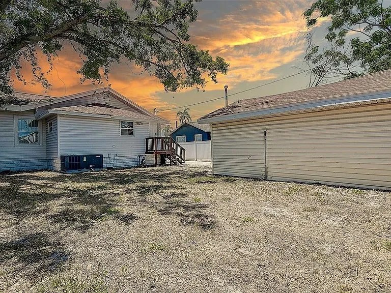Enjoy a low-maintenance 0.13-acre lot with a 1-car detached garage, shed, and additional storage space.