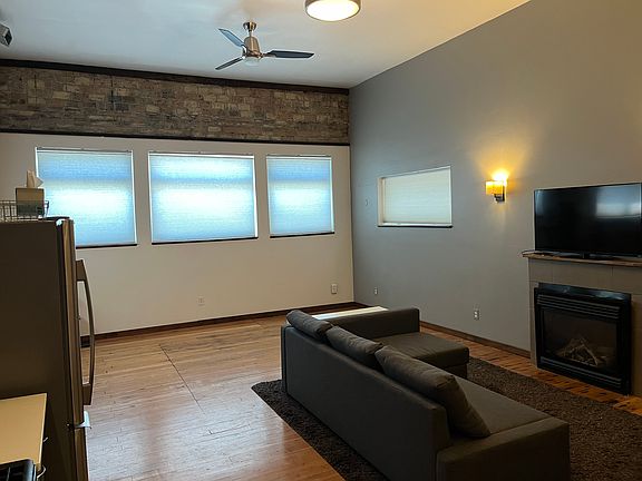 Double-pane windows, fans, and gas fireplace. The unit also has its own heat pump for AC and heat.