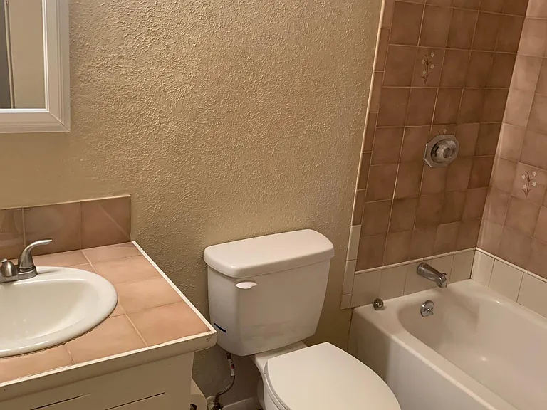Main bathroom with full tub.