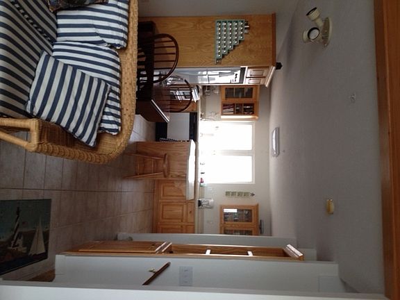 Looking into the Ktichen
						:
						open kitchen to family room and enclosed porch is prefect for entertaining.