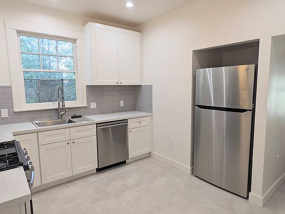 Brand new remodeled kitchen with new appliances, including dishwasher