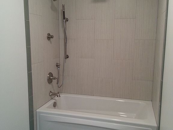 huge Jacuzzi tub with tile surround