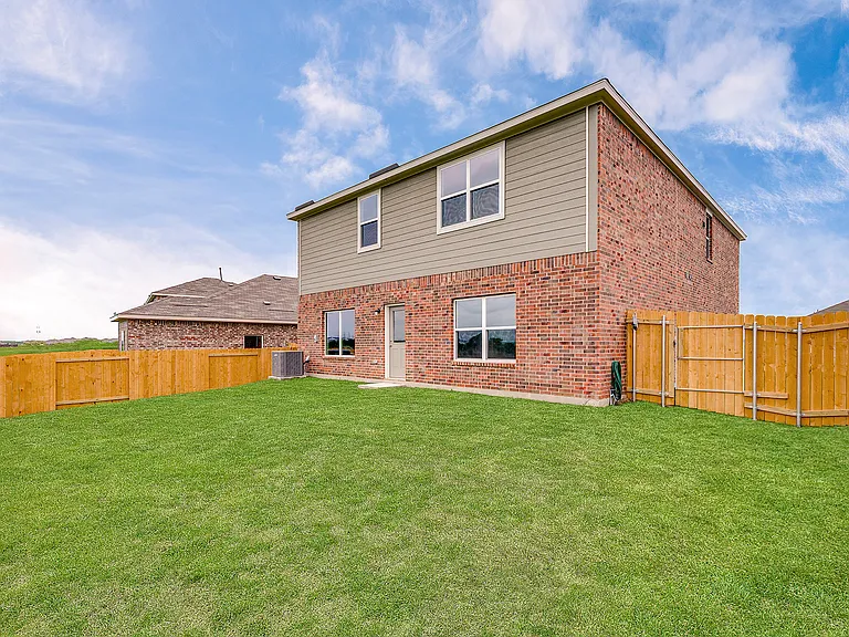 The back yard is fully fenced.