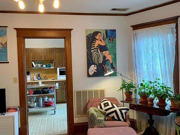 Formal dining room often used as a living room. View into kitchen