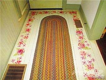 View of the front entry floor and bottom of front entry door.