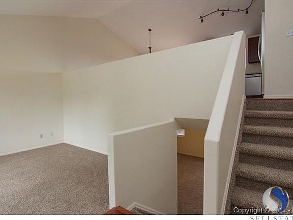Main level - stairs to kitchen and looking down into the family