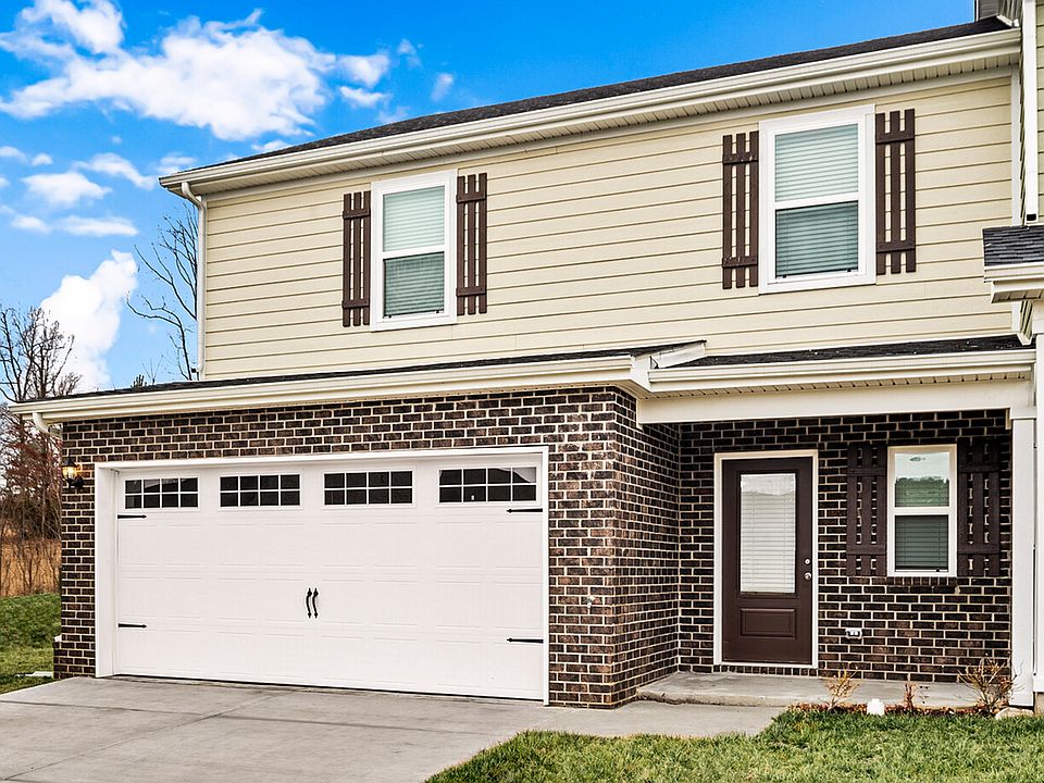 The Montgomery is a beautiful two-story home with siding and brick