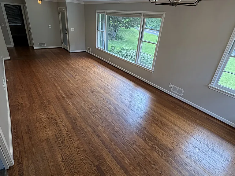 Dining room & living room with large windows to let in the natural light.