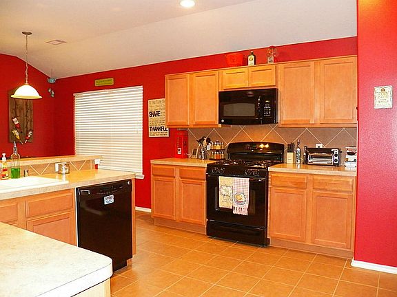 Great tile located through the kitchen & plenty of cabinets.