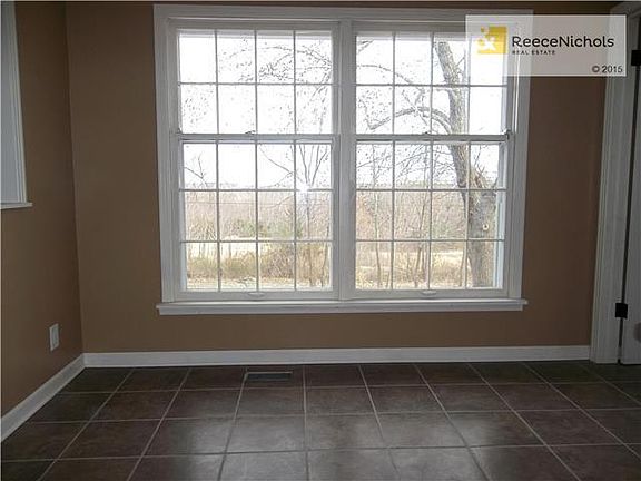 Eat-in area in Kitchen with Ceramic Tile Floor and Double Windows with great view.