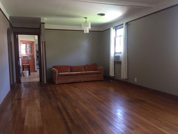 Your beautiful formal living & dining room as you enter the front door. Gleaming hardwood floors!