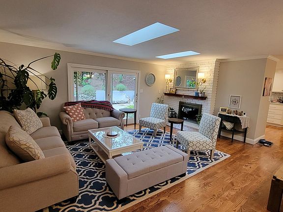 Spacious living room with patio door and skylights