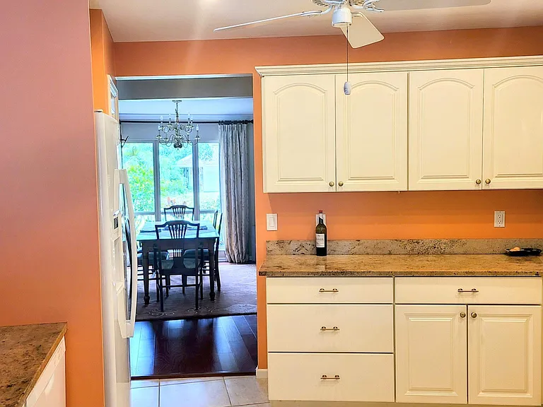 Kitchen with breakfast bar open to formal dining room and separate kitchen nook. Ice maker, filtered water.