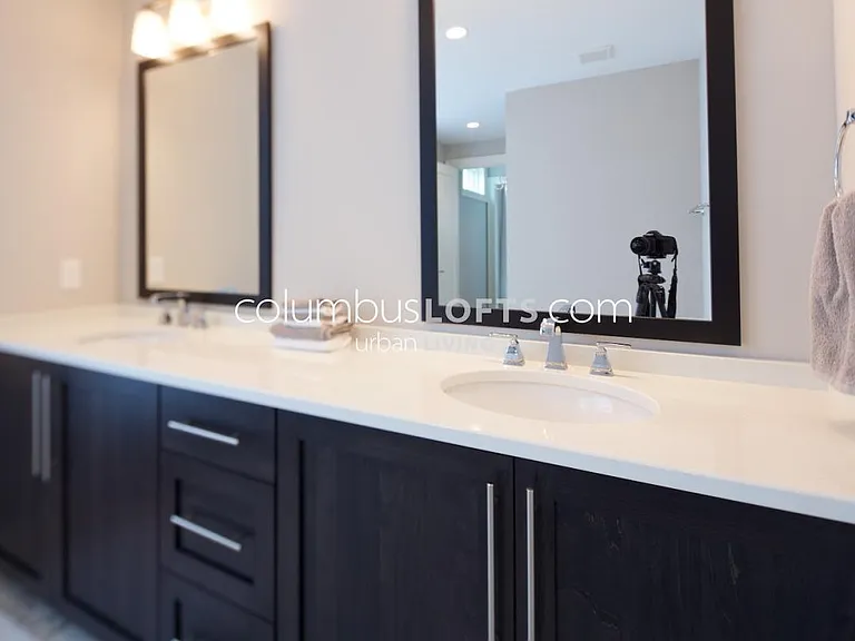 master bathroom has oversized custom walk-in shower and large double vanity