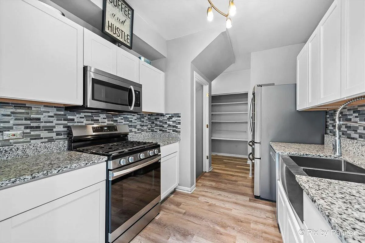 Building Photo - 4909 Spencer Ave #A