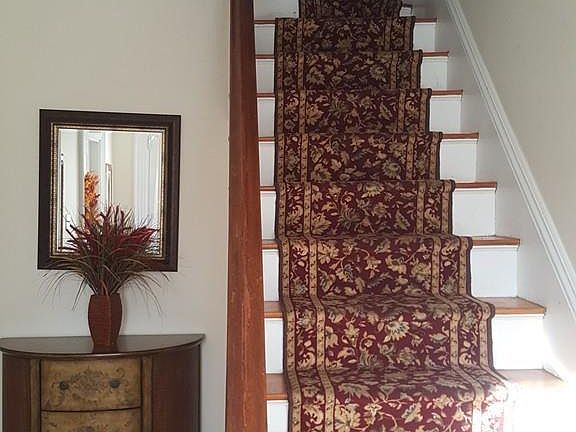 Beautiful staircase leading up to the upper unit.