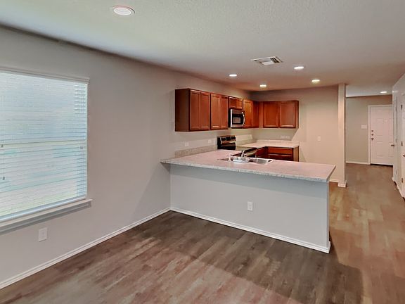 Spacious kitchen with wooden c