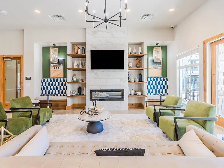 Welcome to Southgate Apartments, where modern design meets comfort. Our stylish lounge features cozy seating, a contemporary fireplace, and vibrant decor, perfect for relaxing or entertaining. Tour today and see your new home!