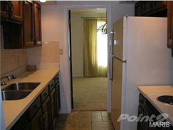 GALLEY KITCHEN LEADS TO DINING AREA