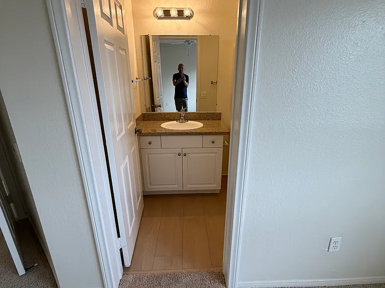 Master bedroom leading into master bathroom